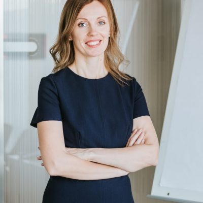 portrait-of-young-attractive-modern-business-woman-in-dark-blue-dress-at-office-looking-at-camera_t20_VL3BVl.jpg